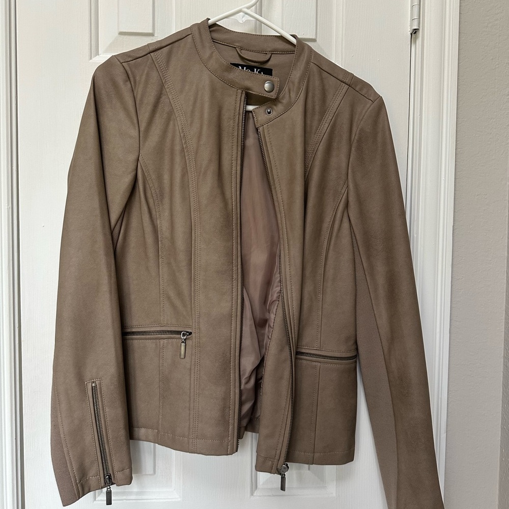 Full zipper Faux leather jacket.